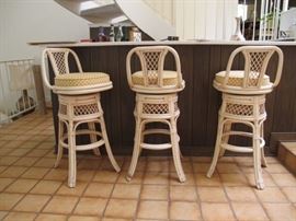 Three vintage rattan bar stools