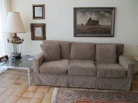 Comfy sofa, smoked glass and chrome table, BIG lantern lamp. 