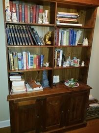 Great large custom made bookshelf with plenty of storage in bottom. 