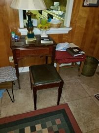 Singer sewing machine with stool.  Have all the parts and books. 