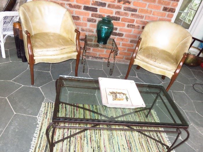 Two antique bucket style leather chairs from New York