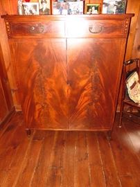 Antique mahogany cabinet linen press. Beautiful crotched mahogany veneer on doors. 7 slide shelves inside