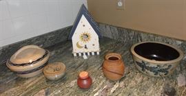 Selection of hand thrown pottery items and wood bird house
