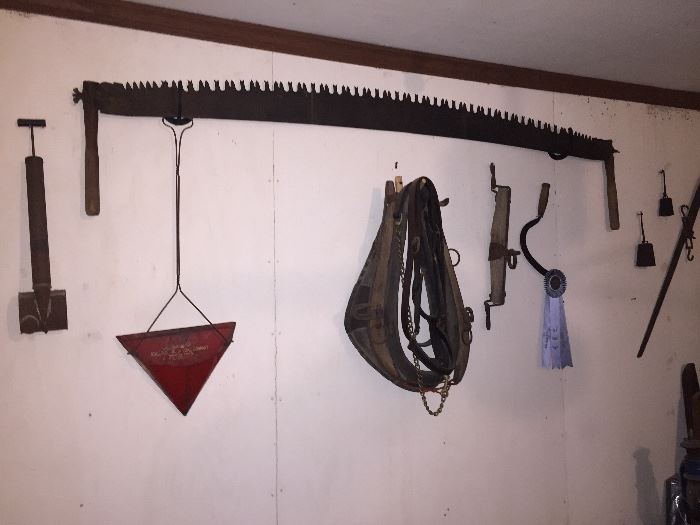 Various farm implements including two man saw, cotton scale...