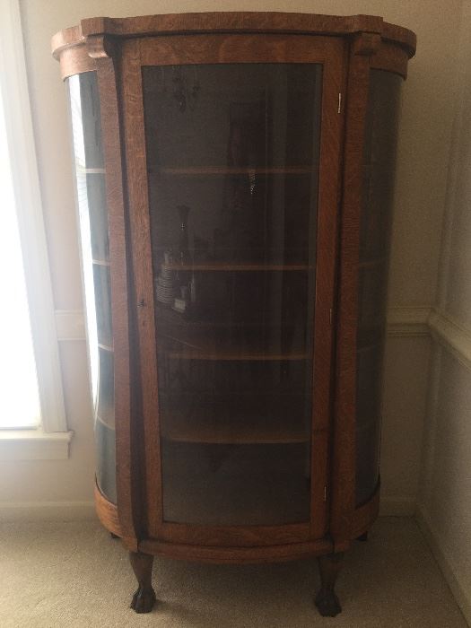 Antique oak bowfront cabinet with key