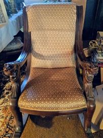 ANTIQUE ROCKER WITH GOTHIC CARVED ARMS