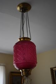 Elegant Antique Cranberry Satin Glass Chandelier over one of the Dining Room Tables