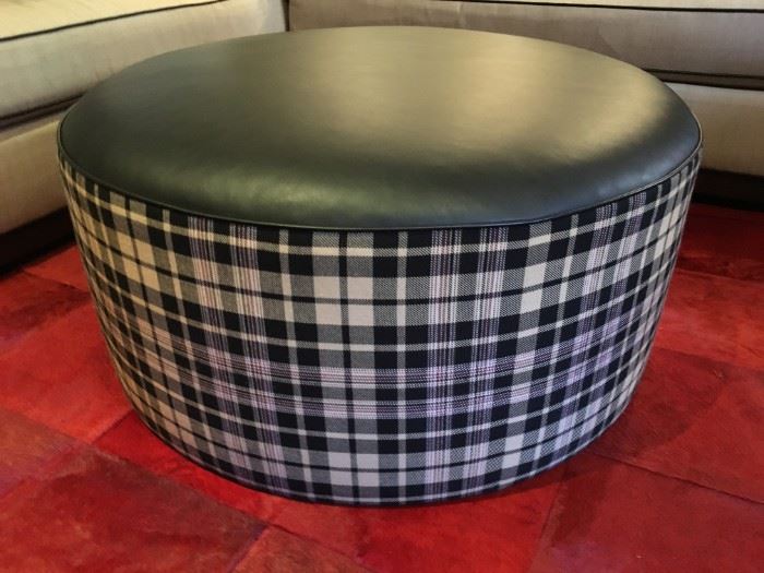 24) Upholstered Round Ottoman in Ralph Lauren "Upton Tartan" and Cowhide in "Lacar Black". 36"d