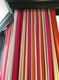 32) Custom pleated drapery panels in three colors of linen, each 12" wide vertical stripe. Colors Pindler's Ghent in Bone, Pindler's Jefferson in Tangerine and O&L's Brera in hot pink.