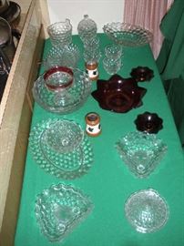 Kitchen:  This is just SOME of the many FOSTORIA AMERICAN glass dishes:  ice bucket, covered sugar, divided dish, cups, bowls, compotes, covered lemon dish, three-corner dishes and more!  Also shown are a set of salt & peppers and ruby glass that is not Fostoria.