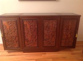 Living Room:  This unique Asian style bar has carved front panels and an open back (photo coming up).  The side tops fold in, and the side doors fold back to make it a different size as you can see in an upcoming photo.  This bar fully extended as shown measures 70" wide x 17-l/2" deep x 37-l/2" tall.  