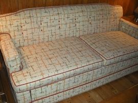 Family Room: A closer photo of the sofa sleeper shows the interesting pattern and reveals its like-new condition!  (Note: this sofa is very near to the back door and can easily be removed upon purchase.)