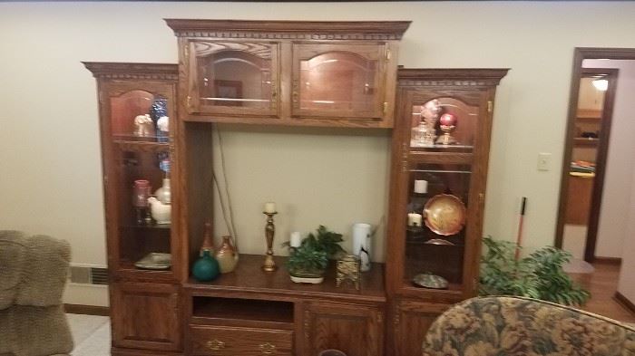 Four-piece lighted entertainment center with storage