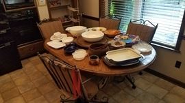 Wood and metal dining table, one leaf, four rolling chairs