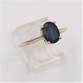Gold ring with black sapphire.