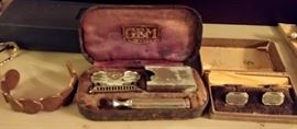 penny bracelet, old razor set in original lined case, & old cuff links in original lined box   -- DINING ROOM