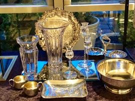 French crystal vases and silver plated serving pieces. 