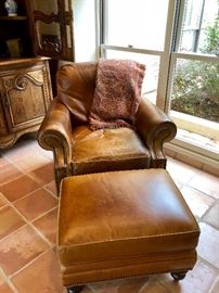  Beautifully worn leather chair and ottoman. Tall tales and whiskey....a manly man‘s chair if ever there was one! 