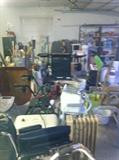 everyting you can imagine in this garage from file cabinets to tools to lots of hammers/ saws/ cement mixing tools etc...