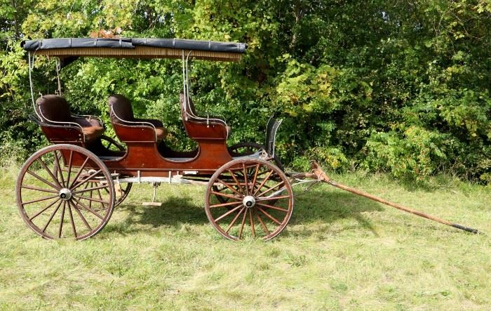 A late 19th century William N. Brockway, Two horse, Three Seat Surrey.  With two lanterns, fringed top canopy and three brown tufted leather seats.  Good original condition, shows wear that is to be expected from age and use, corrosion, some finish loss. 96" h, 66" wide, 132" long (wheel to wheel), 240" long overall.