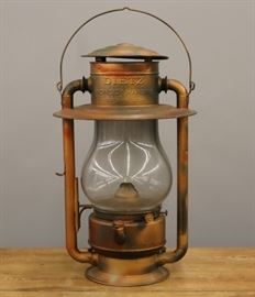An early 20th century Dietz Pioneer Hanging Lantern.  Hanging lantern reportedly used in "The Old Round House" in Calumet, MI.  Repainted, wear and minor denting.  22" high.  