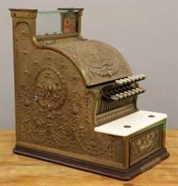 A 1913 NCR Model 317 Brass Candy Store Cash Register.   Wear and minor damage, lacks marquee.  17" high overall.  