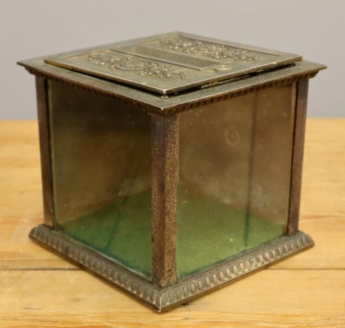 An early 20th century National Cash Register Ticket Box. Cast iron with glass panels. Some wear, lacks key. 6 1/2" high.