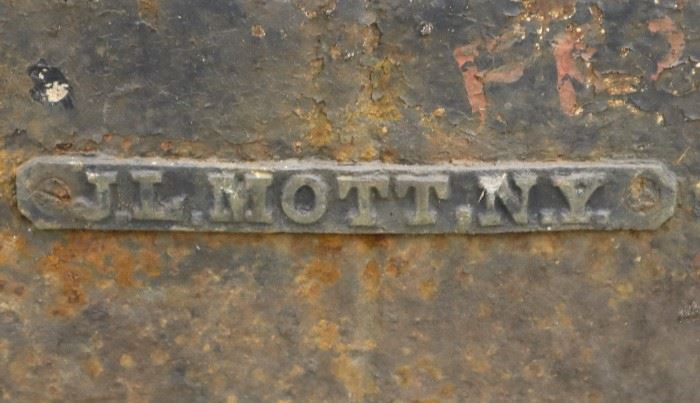 An early 20th century J. L. Mott Cast Iron Figural Hitching Post.   Marked "J.L. Mott" on the back panel of the base.  Old worn repaint with corrosion.  46 1/4" high overall.  