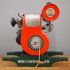 An early 20th century Wisconsin Type AB Engine.  Original decal reads "Wisconsin Heavy Duty Air Cooled Engines".  Repainted with some wear and repair.  23 3/4" high overall. 