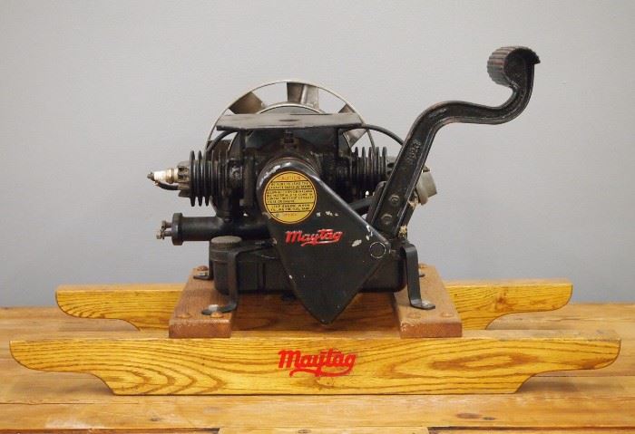 A Vintage Maytag  Model 72-DA Appliance Engine.  Gas engine with foot pedal start on a wood frame.  Repainted with some wear.  17" h x 12" w x 29" l overall.