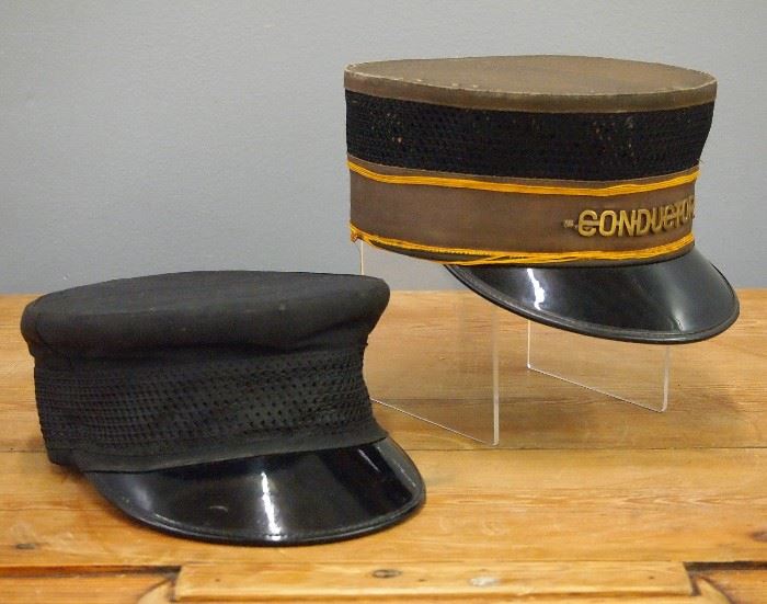 Two Vintage Railroad Hats.  Including one hat with "Conductor" badge.  Up to 10" long.  Fabric on each shows some soiling and wear.  
