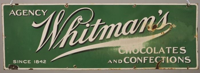 An early 20th century Whitman's Porcelain Enamel Side.  Single sided sign reads "Agency Whitman's Chocolates and Confections Since 1842".  Surface wear and some damage, one corner is bent.  39 1/2 x 13 1/2" high. 