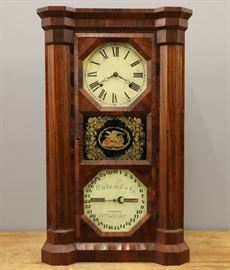 A mid 19th century Seth Thomas "Parlor Calendar No. 2" shelf clock.  8-day time and strike movement with a painted metal dials.  Rosewood case with molded crown and feet, single door with eglomise central panel.  Older refinishing with minor wear, veneer repair and some damage.  Running when cataloged.  30 1/2" high.