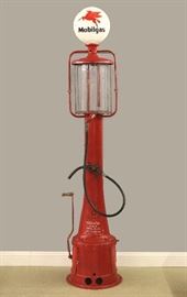 A 1920's Fry Model 117 Visible gas pump.  Iron pump with a 10 gallon glass cylinder and vintage "Mobilgas" globe.  Older Red repaint, bullet hole in cylinder, lacks indicators, some replaced parts, as/is.  Approx. 120" high overall.