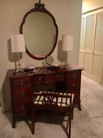 So cute! Vintage mahogany keyhole desk (or vanity). Shown with vanity bench and mirror.