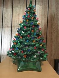 One of three vintage lighted handmade ceramic Christmas trees.