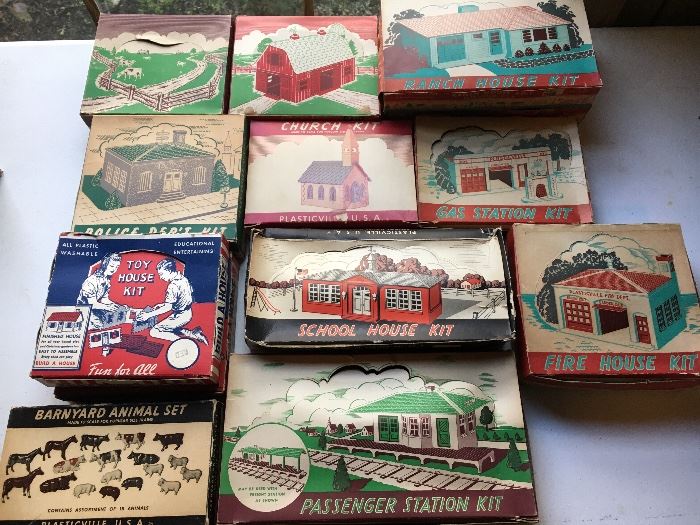 Vintage Plasticville buildings, unbuilt in original boxes.