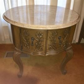 Small table with simulated marble top and storage.