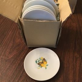 Vintage, unused and still in box—one dozen small butterfly plates.