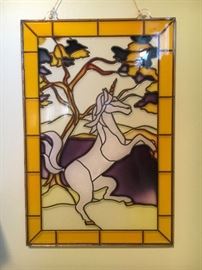 Wall decor—plastic stained glass look unicorn.