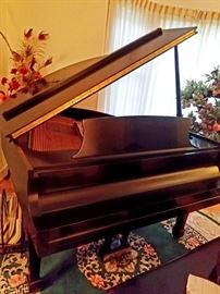Steinway baby grand piano satin finish. Like new.