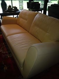 Pale yellow 2-cushion, 3-person sofa