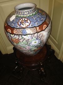 Another Asian porcelain floor vase with brilliant colors and with stand