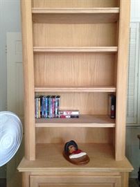 Very tall unfinished book case waiting for YOU to select the color or stain.