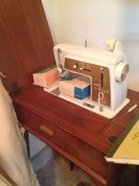 Singer Touch & Sew sewing machine in a cabinet