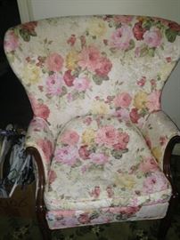 A perfectly precious bedroom chair with pink and yellow roses 