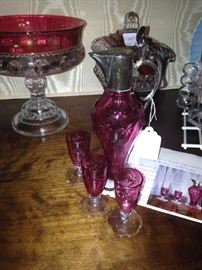 Silver plated fittings on early 1900's cranberry glass ewer ( 7 1/2 inches tall ) complete with 3 cordials