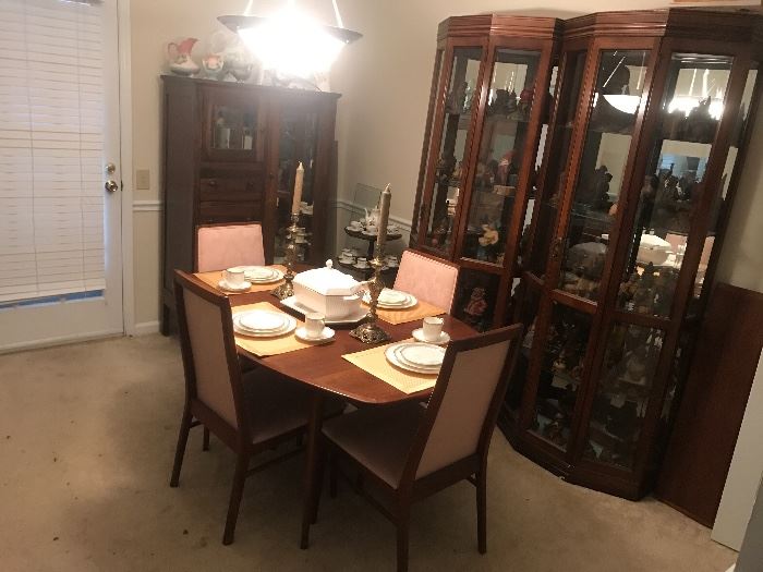 Danish Modern Dining table - has leaf extension.  Full view curios in background