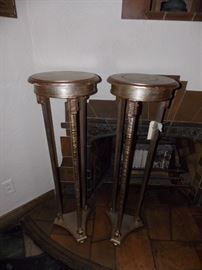 A pair of silver and gold leaf pedestals