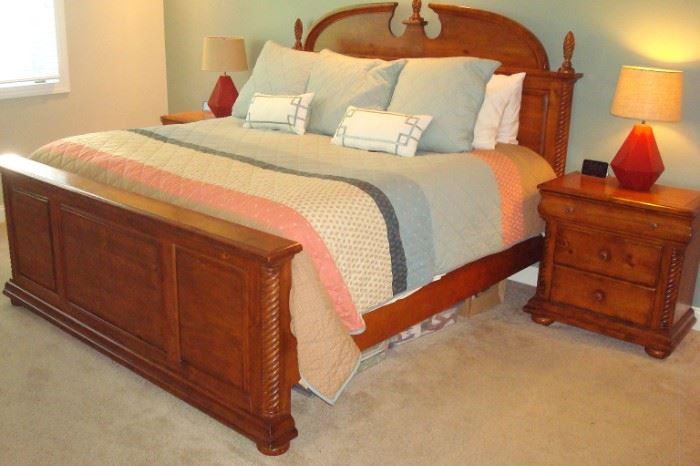 King bed and bedside table to bedroom suite.